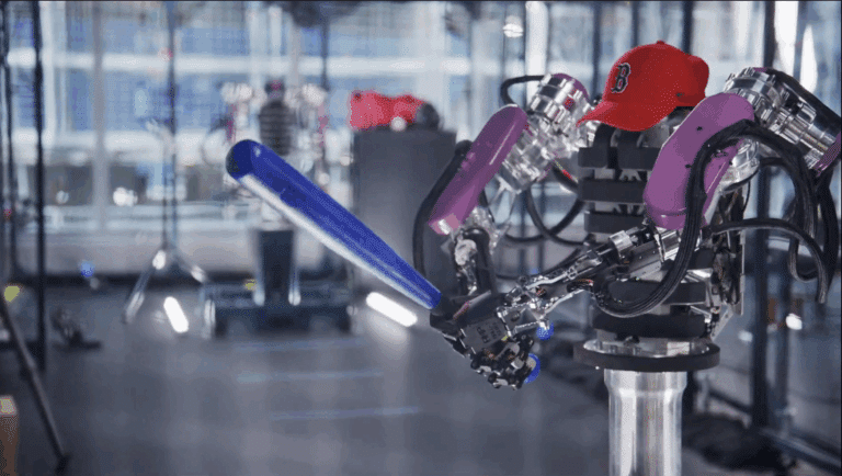 two armed robot holds bat to play and wears hat to play baseball